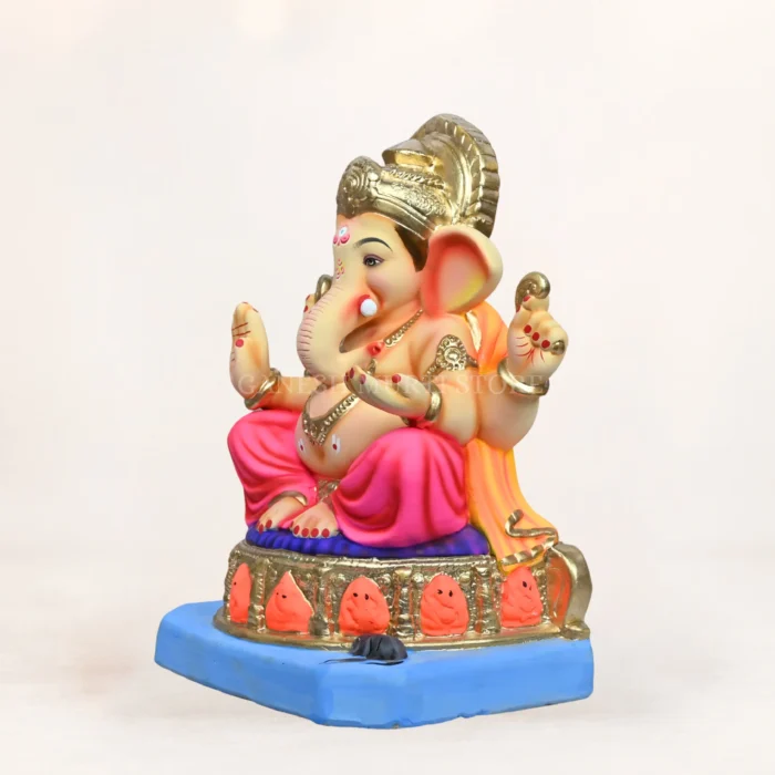 Side profile view of 15 inch eco friendly Shadu Mati Ashtavinayak Ganpati idol with pink dhoti