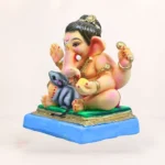 Side view of 12 inch Baal Ganesh clay idol with Mushak in pink dhooti for eco-friendly Ganesh Chaturthi