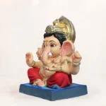 Side view of 15 inch eco friendly Shadu Mati Bal Gattu Ganpati murti in red dhoti