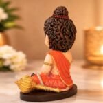 Three quarter angle view of Balveer Hanuman Ji clay idol for car dashboard and home mandir
