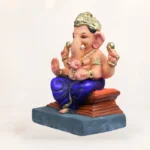 Side angle view of 12 inch Ambuja light yellow KP eco-friendly clay Ganesh idol for home pooja