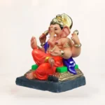 Alt Text: Front view of 12 inch Coach-N orange dhoti eco-friendly clay Ganesh idol for home pooja