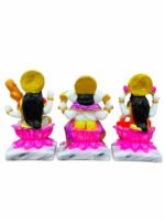 Back view of Handcrafted Marble Dust Ganesh Laxmi Saraswati Trio Idol Set showcasing golden sunburst halos