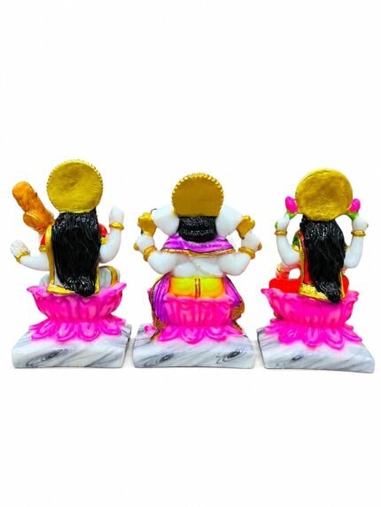 Back view of Handcrafted Marble Dust Ganesh Laxmi Saraswati Trio Idol Set showcasing golden sunburst halos