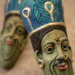 Close-up of Handcrafted Terracotta Tribal Couple Face Wall Hanging 9 Inch