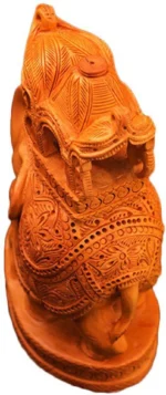Close-up view of handcrafted wooden Ambabari elephant statue showing intricate royal caparison and wood carving details