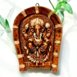 Handmade terracotta wall hanging of Lord Ganesha on rice plate measuring 15 cm for home decor