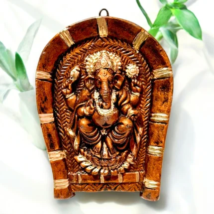 Handmade terracotta wall hanging of Lord Ganesha on rice plate measuring 15 cm for home decor