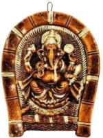 Top-down angle view of handmade terracotta Lord Ganesha wall hanging showcasing round rice plate artistry