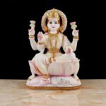 Handcrafted Hindu Goddess Lakshmi Idol seated on lotus base with golden ornaments