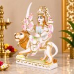 Side angle view of Marble Durga Devi Idol on lion vahana showing handcrafted gold embellishments