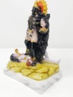 Side angle view of 7 Inch Handcrafted Marble Dust Kali Mata Idol in traditional red saree