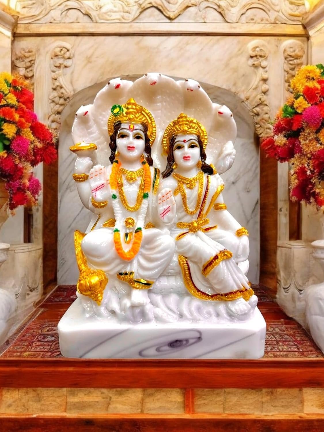 Marble Statue of Lord Vishnu and Goddess Lakshmi Marble Statue of Lord Vishnu and Goddess Lakshmi Seated on Sheshnaag