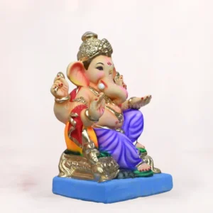 Side profile of 14 inch eco friendly Shadu Mati Ganpati murti with royal blue dhoti and parbhal load