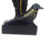 Close-up side profile of the sacred crow base on Black Marble Dust Shanidev Idol