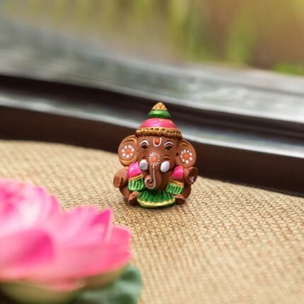 Handpainted terracotta earthenware baby Ganesha idol for car dashboard and home decor