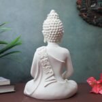 Side angle view of The Advitya Polymarble Meditating Buddha Statue showing gold robe details