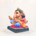 Side view of 14 inch eco friendly Shadu Mati Undir Gattu Ganpati murti in light blue dhoti
