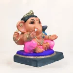 Side profile of 14 inch eco friendly Shadu Mati Undir Gattu Ganpati murti in pink dhoti