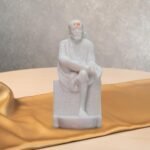 White Marble Sai Baba Idol in Samadhi Mandir style highlighting peaceful posture and base details