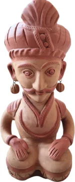 Close-up view of handcrafted Indian terracotta musician figurine highlighting traditional instrument details