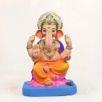 Eco-friendly 15-inch yellow dhoti Ganpati murti with kamal (lotus) motif for Ganesh Chaturthi decoration